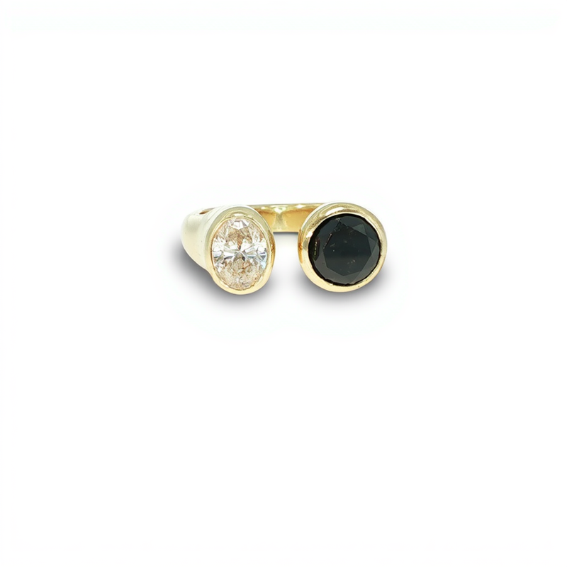 A wide three row yellow gold statement band stacking channels of dark blue sapphires and clear white diamonds from a custom jewelry creator