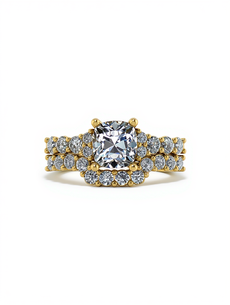 A matching custom jewelry creator bridal set featuring a cushion cut diamond center stone surrounded by micro pave diamond bands