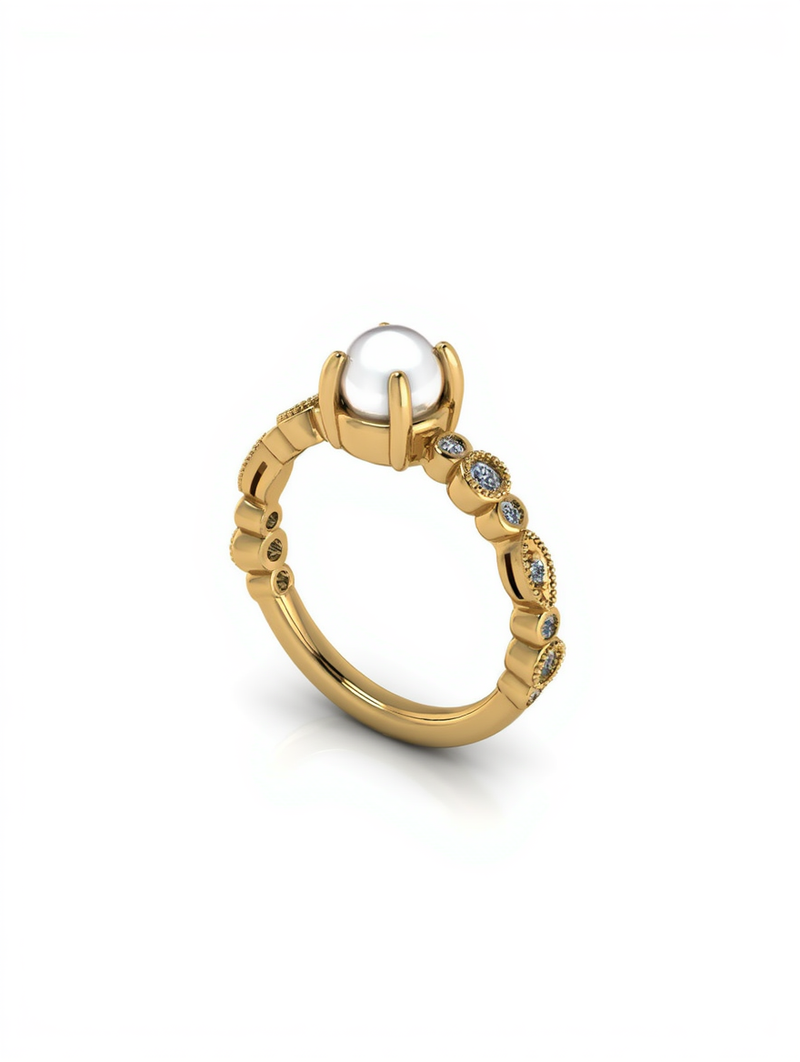 A single white cultured pearl held by secure gold prongs on a yellow gold band decorated with milgrain borders and bezel set diamonds from a custom jewelry creato