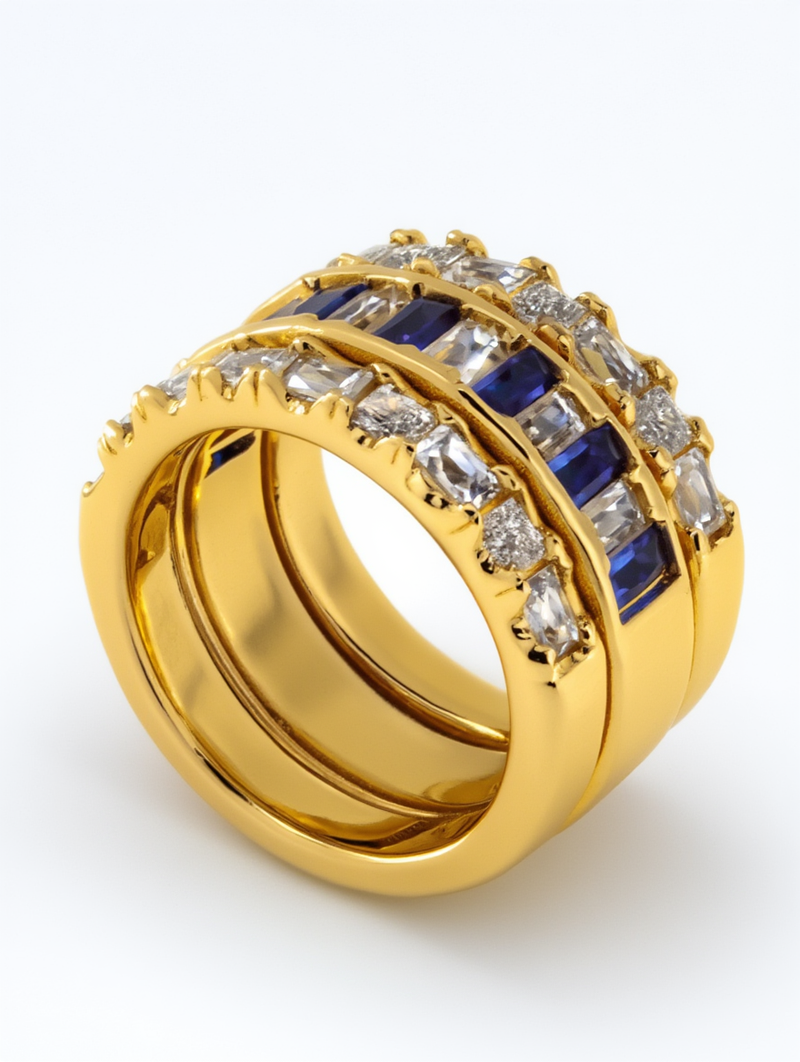 A custom jewelry creator engagement ring featuring a center black diamond in a dramatic vertical kite setting accented by white diamonds on a platinum shank