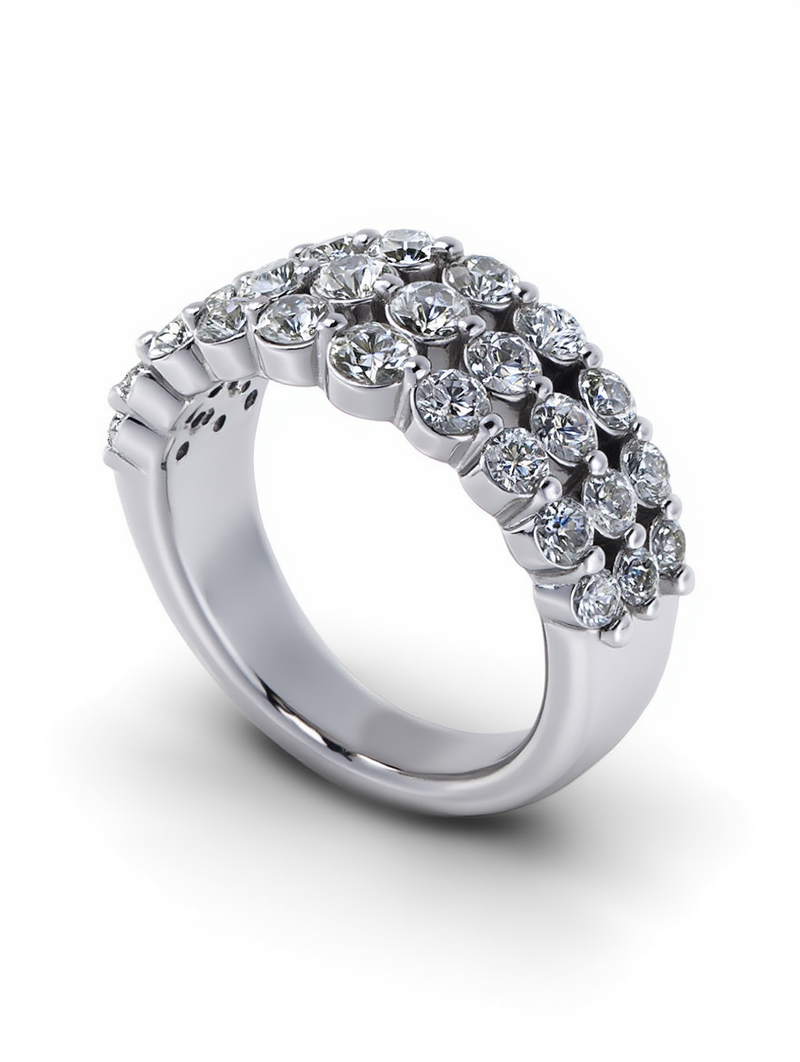 A thick platinum anniversary ring featuring three rows of brilliant round diamonds in a dense pave setting by a custom jewelry creator